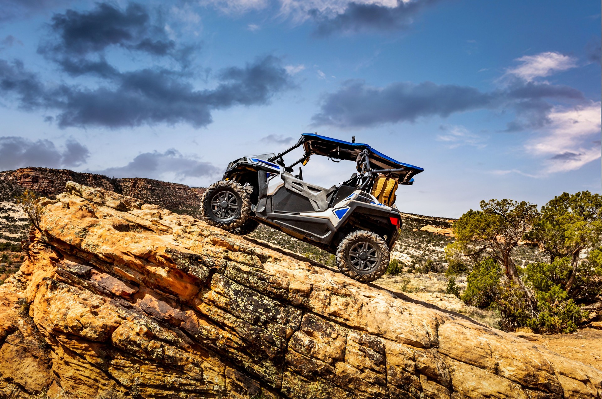 4x4 Side-by-Side off-road vehicle, UTV ATV with a beautiful mountain range in the background near the Colorado and Utah border.